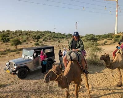 A camel caravan crossing the Cholistan dunes